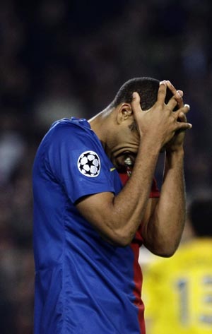 Barcelona's Thierry Henry reacts after teammate Samuel Eto'o missed a opportunity to score during their Champions League semi-final, first leg soccer match against Chelsea in Barcelona April 28, 2009.