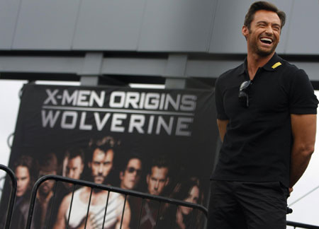 Actor Hugh Jackman laughs on stage at the premiere of the movie 'X-Men Origins: Wolverine' in Tempe, Arizona April 27, 2009. 