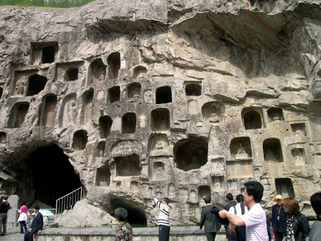Chinese tourists visit the Longmen Grottoes, a world cultural heritage, near Luoyang City in central China's Henan Province, May 2, 2009, the second day of the three-day May Day holiday. China has a totality of 37 world heritages which attract many tourists in the holiday. 