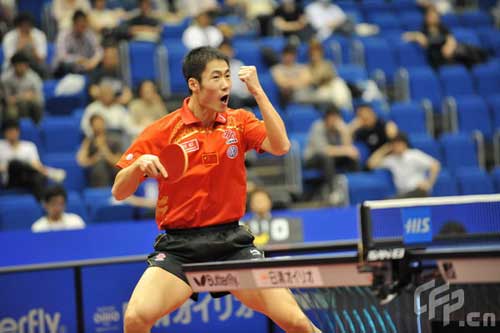 Wang Liqin celebrates after defeating teammate Chen Qi in the quarterfinals of men's singles. 