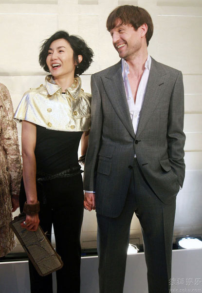 Film star Maggie Cheung and her German architect boyfriend Ole Scheeren attend a fashion party held by the luxury brand Burberry in Beijing on April 30, 2009. 