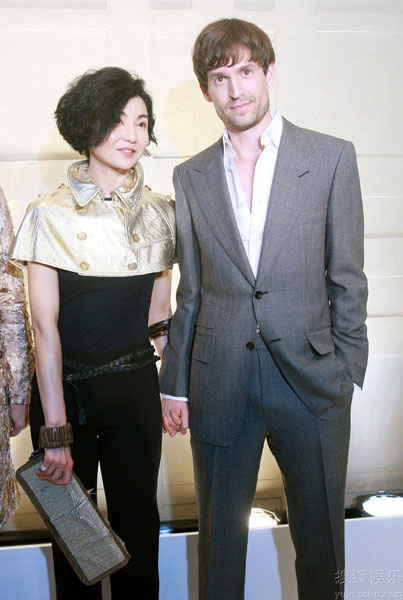 Film star Maggie Cheung and her German architect boyfriend Ole Scheeren attend a fashion party held by the luxury brand Burberry in Beijing on April 30, 2009. 