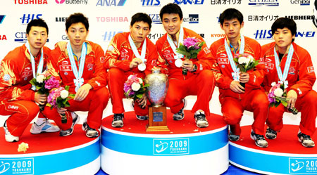 Chinese medallists for men's doubles pose for photos on the podium during the World Table Tennis Championships in Yokohama, south of Tokyo May 4, 2009. The winners are (L-R) silver medallists Ma Long and Xu Xin, gold medallists Chen Qi and Wang Hao, and bronze medallists Zhang Jike and Hao Shuai. [Xinhua]