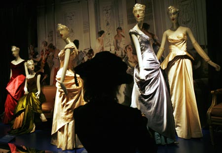 A visitor views an installation for The Costume Institute