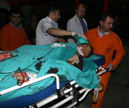 A injured villager is carried onto an ambulance at the Bilge village near the city of Mardin, southeast Turkey, May 4, 2009. At least 44 people were killed and 17 others were wounded in a brutal armed attack on a wedding party in southeast Turkey on Monday, hospital officials said. (Xinhua/Anadolu) 