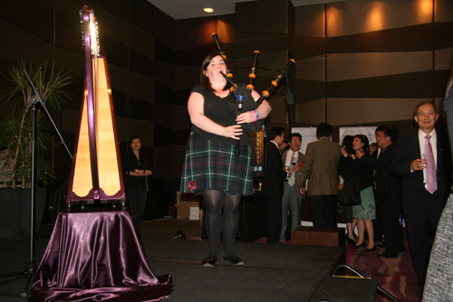 The formidable Lady Piper Zoey Maciver pipes Scotland's First Minister Alex Salmond into the evening reception.