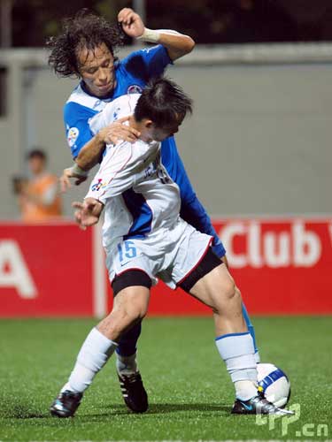 Park Tae Won (L) of Singapore Armed Forces FC and Shen Longyuan (R) of Shanghai Shenhua competes for the ball during the AFC Champions League Group G match between the Singapore Armed Forces FC and Shanghai Shenhua at Jalan Besar Stadium on May 5, 2009 in Kallang, Singapore.