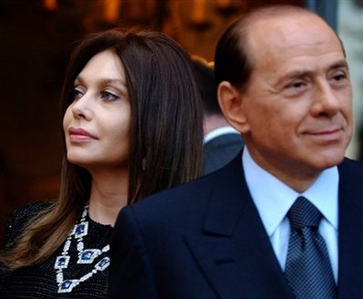 Italian Prime Minister Silvio Berlusconi and his wife Veronica Lario. On Monday May 4, 2009, Berlusconi's wife, Veronica Lario, 52, announced that she was filing for divorce from the Prime Minister, 72, after disputes over his relations with younger women. [Xinhua/Reuters]