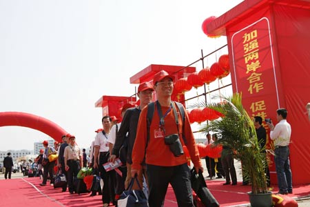  Passengers walk to board deluxe six-star "Asia Star" cruise liner at the Zhuchi Harbor in Shantou, south China