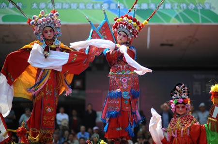 Actors perform "Beigun", a traditional folk art usually held to pray for harvest and peace, during a folk cultural carnival in Taiyuan, capital of north China