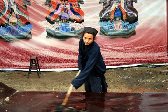 Taoists prepare for a memorial service for victims of the Wenchuan earthquake at Yanxian Guan temple on May 12, 2009. The temple, near Mianzhu in Sichuan, was the residence of Yan Junping, one of the founders of the Taoist religion during the Western Han Dynasty (207BC-AD25). It was badly damaged in the earthquake and is currently being restored. [John Sexton, China.org.cn, May 9, 2009] 