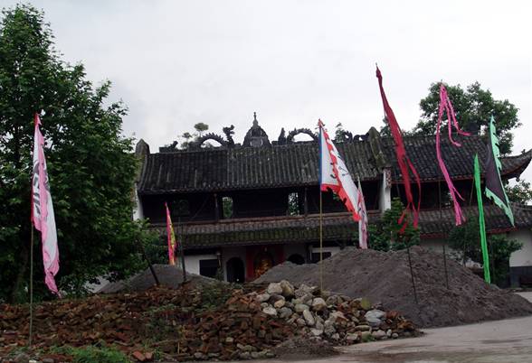 Taoists will carry out a memorial service for victims of the Wenchuan earthquake at Yanxian Guan temple near Mianzhu, Sichuan, on May 12, 2009. The temple, which was the residence of Yan Junping, one of the founders of the Taoist religion during the Western Han Dynasty (207BC-AD25), was badly damaged in the earthquake and is currently being restored. [John Sexton/China.org.cn] 