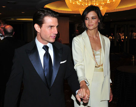 Tom Cruise and Katie Holmes pose for pictures on their way into the White House Correspondents Dinner on Saturday night (May 9) in Washington, D.C.