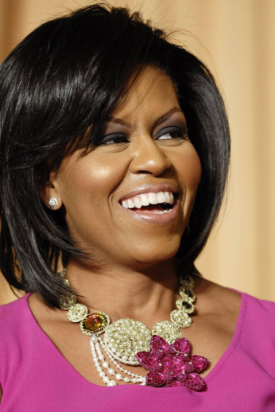 US first lady Michelle Obama laughs during the White House Correspondents' Association Dinner in Washington, May 9, 2009.