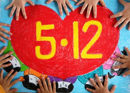 Kids put their hands on a drawing with the date of the May 12 earthquake in commemoration of the victims of the earthquake last year, during an activity in a kindergarten in Xingtai, north China's hebei Province, May 11, 2009. As the first anniversary of the earthquake approaches, people all over China commemorate the disaster in different ways.[Xinhua] 