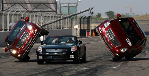 Hollywood vehicular stunt team performs car-surfing at Shanghai F1 International Circuit Saturday May 9, 2009. [Xinhua]