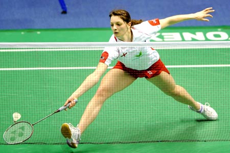 Sarah Walker of England returns the shuttle to Adriyani Firdasari of Indonesia during the women's singles competition at the 11th Sudirman Cup World Team Badminton Championship in Guangzhou, south China's Guangdong Province, May 11, 2009. (Xinhua/Li Gang) 
