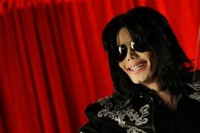 U.S. pop star Michael Jackson gestures during a news conference at the O2 Arena in London March 5, 2009. Jackson said he will hold a series of final concerts in Britain later in the year.