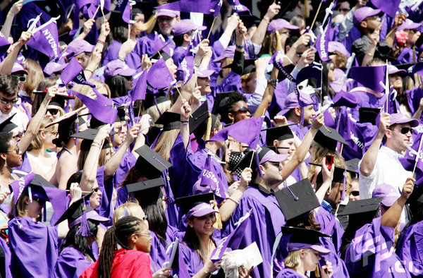 Graduates cheer as over 5,000 students participate in New York University's commencement exercise held at Yankee Stadium on May 13, 2009 in New York.[CFP]