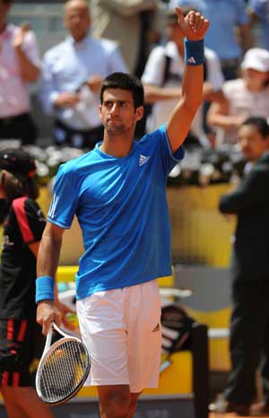 Novak Djokovic of Serbia celebrates for winning over Oscar Hernandez of Spain during the men's singles 2nd round match at the Madrid Open tennis tournament in Madrid, Spain, May 13, 2009. Djokovic won the match 2-0, and advanced into the next round. (Xinhua/Chen Haitong)