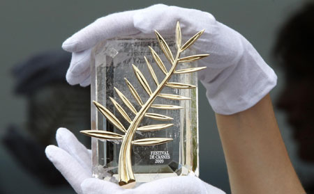 A Chopard representative displays the Palme d'Or in Cannes May 12, 2009. The 62nd Cannes Film Festival runs from May 13-24.