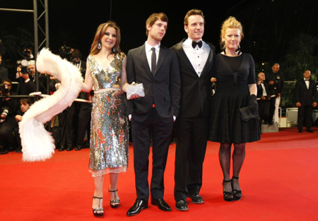 Director Andrea Arnold (R) poses with cast members (L to R) Kierston Wareing, Harry Treadaway and Michael Fassbender as they arrive for the screening of the film 