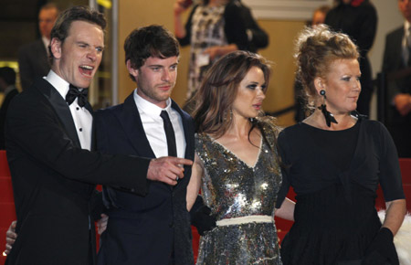 Director Andrea Arnold (R) poses with cast members (L to R) Michael Fassbender, Harry Treadaway and Kierston Wareing as they arrive for the screening of the film 