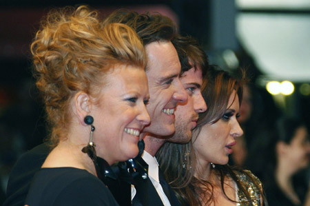 Director Andrea Arnold (L) poses with cast members (2nd from L to R) Michael Fassbender, Harry Treadaway and Kierston Wareing as they arrive for the screening of the film 