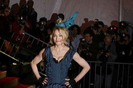 Singer Madonna, wearing a design by Louis Vuitton, poses at the Metropolitan Museum of Art Costume Institute Gala 'The Model As Muse: Embodying Fashion' in New York May 4, 2009.