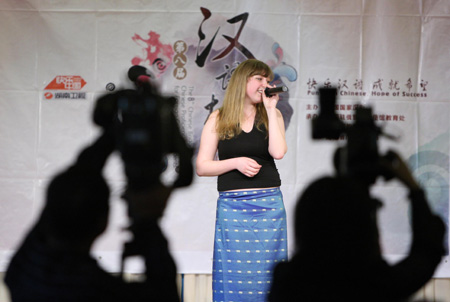 Contestant Jelena sings a Chinese song during the Moscow round of the 'Chinese Bridge' competition, a Chinese-language proficiency contest for foreign college students in Moscow, capital of Russia, May 17, 2009.