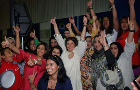 University professor Acil al-Awadi (C), a candidate in Kuwait's parliamentary elections, celebrates her victory with supporters in Kuwait City on May 17, 2009. Four women won their first seats during the parliamentary elections held on May 16.