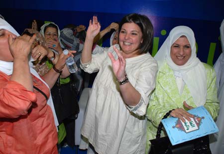 University professor Acil al-Awadi (C), a candidate in Kuwait's parliamentary elections, celebrates her victory with supporters in Kuwait City on May 17, 2009. Four women won their first seats during the parliamentary elections held on May 16.