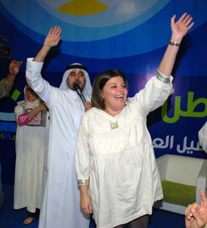 University professor Acil al-Awadi (front), a candidate in Kuwait's parliamentary elections, celebrates her victory in Kuwait City on May 17, 2009. Four women won their first seats during the parliamentary elections held on May 16.