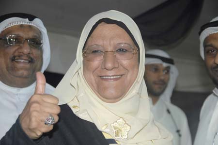 Candidate Massuma al-Mubarak celebrates her victory with supporters in Kuwait City on May 17, 2009. Four women won their first seats during the parliamentary elections held on May 16.