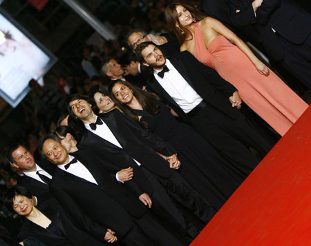 Director Ang Lee (front, L2) and his wife Janice Lin (front, L1) arrive with crew and cast members for the screening of the film "Taking Woodstock" at the 62nd Cannes Film Festival in Cannes, France, May 16, 2009. "Taking Woodstock" competes with other 19 films for the prestigious Palme d