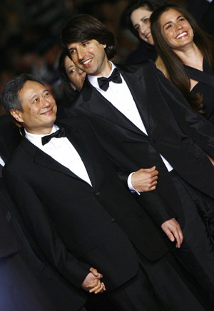 Director Ang Lee (L) arrives for the screening of his film "Taking Woodstock" at the 62nd Cannes Film Festival in Cannes, France, May 16, 2009. "Taking Woodstock" competes with other 19 films for the prestigious Palme d