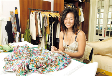 California-born self-taught designer Cairn Wu sews a dress at her studio in an old lane on Chongqing Road in Shanghai.