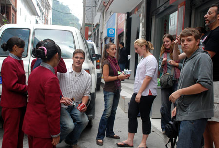 Some foreign tourists of the tour group that have been lifted the quarantine for suspected A/H1N1 case, are ready to leave Zham for Xigaze City in Tibet Autonomous Region, west China, May 20, 2009. Tibet Autonomous Region lifted the quarantine on a foreign tourist group Wednesday as one of its members, previously suspected of having A/H1N1 influenza, was confirmed to have just an 'seasonal flu', said a senior official. [Xinhua]