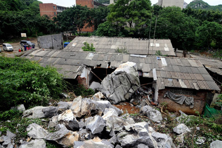 The picture taken on May 20, 2009 shows a local residece which was destroyed by rolling stones after a heavy rain hit Liuzhou city, southwest China's Guangxi Zhuang Autonomous Region. Two people were injured in the incident. Heavy rain swept across provinces in south China for the second day and agricultural crops in some rural areas were flooded by the unexpected summer flood. [Xinhua]