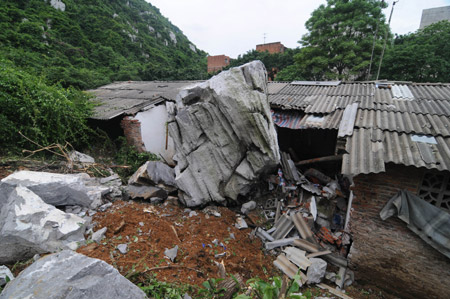 The picture taken on May 20, 2009 shows a local residece which was destroyed by rolling stones after a heavy rain hit Liuzhou city, southwest China's Guangxi Zhuang Autonomous Region. [Huang Xiaobang/Xinhua] 