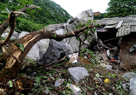 The picture taken on May 20, 2009 shows a local residece which was destroyed by rolling stones after a heavy rain hit Liuzhou city, southwest China's Guangxi Zhuang Autonomous Region. [Xinhua] 