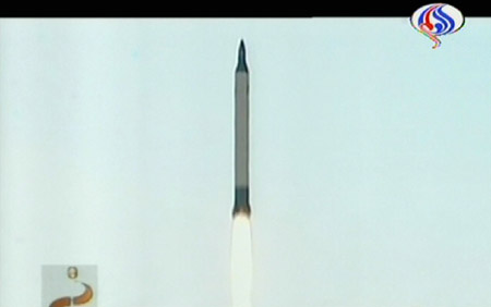A video frame grab shows an Iranian surface-to-surface Sejil 2 missile flying past a weather balloon as it was launched from a site in Semnan May 20, 2009. Iran launched a missile with a range of close to 2,000 km (1,200 miles) on Wednesday.(Xinhua/AFP Photo)