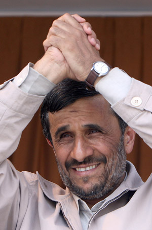 Iranian President Mahmoud Ahmadinejad gestures as he addresses thousands of people in the northern town of Semnan. Ahmadinejad said Iran has test-fired a new medium-range surface-to-surface missile and again insisted there will be no climbdown over Iran's nuclear programme.(Xinhua/AFP)