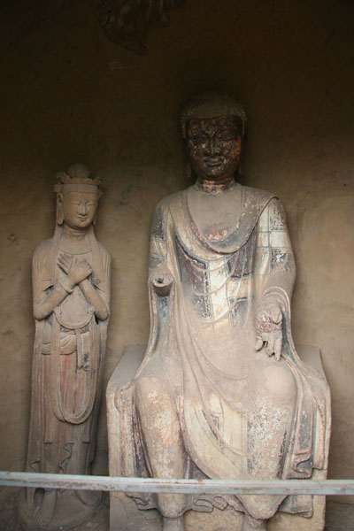 This photo, taken on May 19th, 2009, shows the sculptures and mural paintings found in the Maijishan grottoes. There are 194 existing caves, in which are preserved more than 7,200 sculptures made from terra cotta and over 1,200 square meters of murals. [Photo: CRIENGLISH.com/ Zhao Lixia]