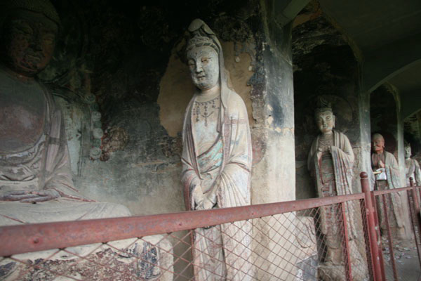 This photo, taken on May 19th, 2009, shows the sculptures and mural paintings found in the Maijishan grottoes. There are 194 existing caves, in which are preserved more than 7,200 sculptures made from terra cotta and over 1,200 square meters of murals. [Photo: CRIENGLISH.com/ Zhao Lixia] 