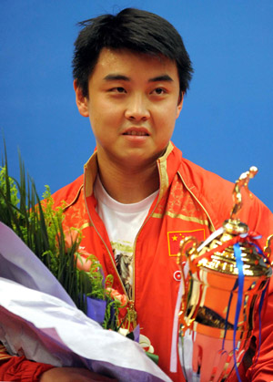 China's Wang Hao reacts during the awarding ceremony for the final of men's singles at the 22nd Asian Cup table tennis tournament in Hangzhou, capital of east China's Zhejiang Province, May 21, 2009. (Xinhua/Xu Yu)