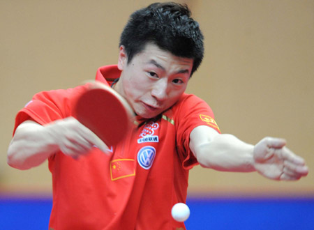 China's Ma Long acts against his compatriot Wang Hao during the final of men's singles at the 22nd Asian Cup table tennis tournament in Hangzhou, capital of east China's Zhejiang Province, May 21, 2009. (Xinhua/Xu Yu)