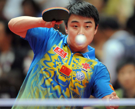 China's Wang Hao acts against his compatriot Ma Long during the final of men's singles at the 22nd Asian Cup table tennis tournament in Hangzhou, capital of east China's Zhejiang Province, May 21, 2009.(Xinhua/Xu Yu)