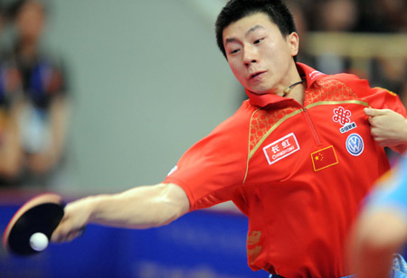 China's Ma Long acts against his compatriot Wang Hao during the final of men's singles at the 22nd Asian Cup table tennis tournament in Hangzhou, capital of east China's Zhejiang Province, May 21, 2009. (Xinhua/Xu Yu)