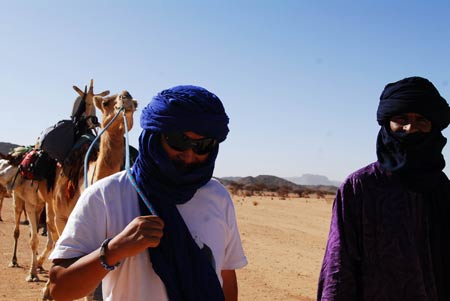 Chinese explorer Jin Feibao rests in the Sahara Desert, May 22, 2009. 